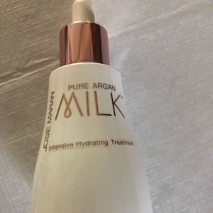 Josie Maran 2oz bottle of MILK for the face.